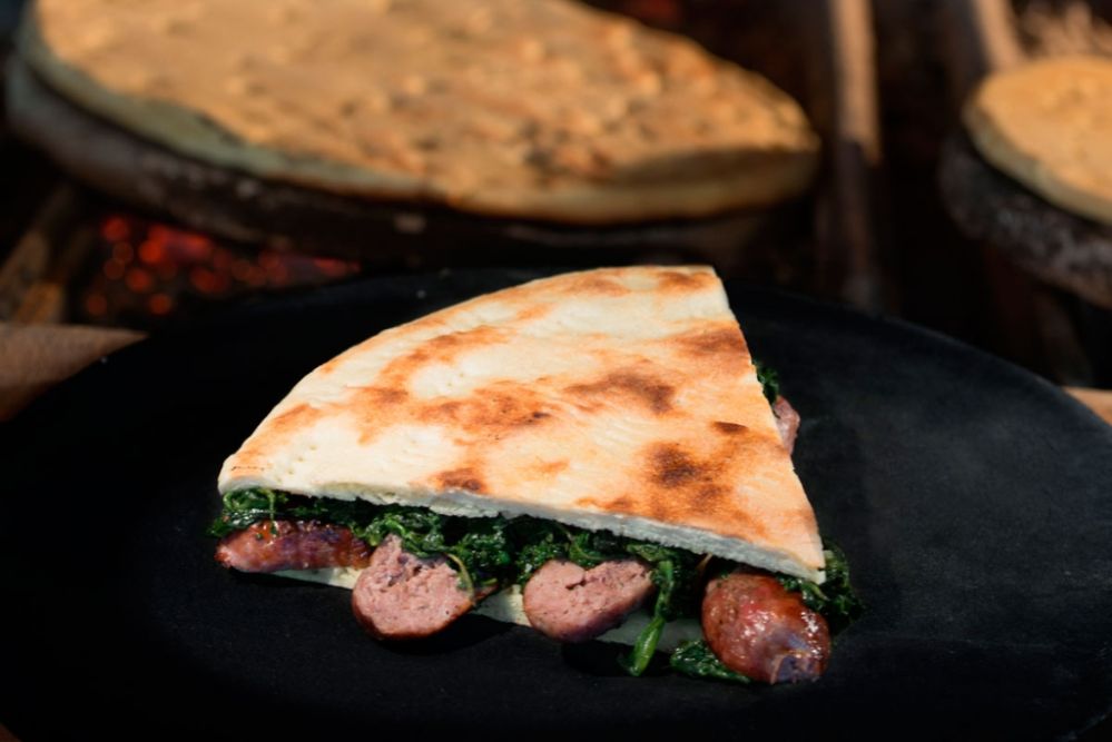 An den Umbrier liegt viel an der Originalität des Rezepts der Torta al Testo weshalb man sie nicht mit einer normalen Focaccia verwechseln sollte. Photo: www.faliero.it/trattoria